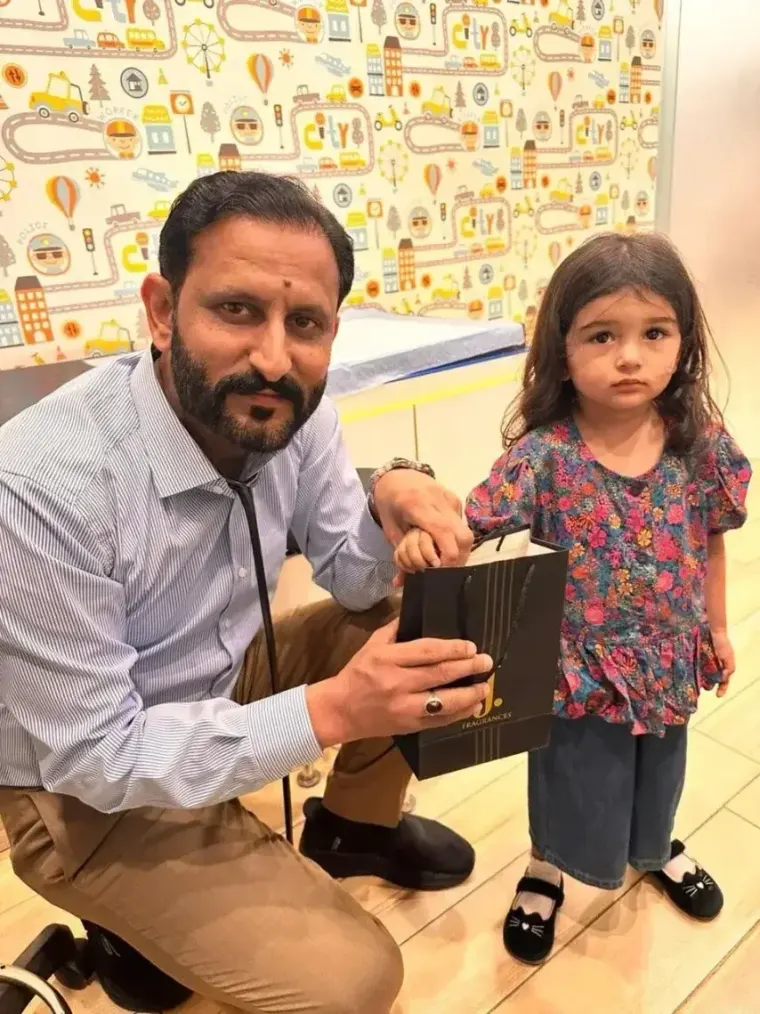 Dr. Raja Imran child specialist in Rawalpindi interacting with a pediatric patient